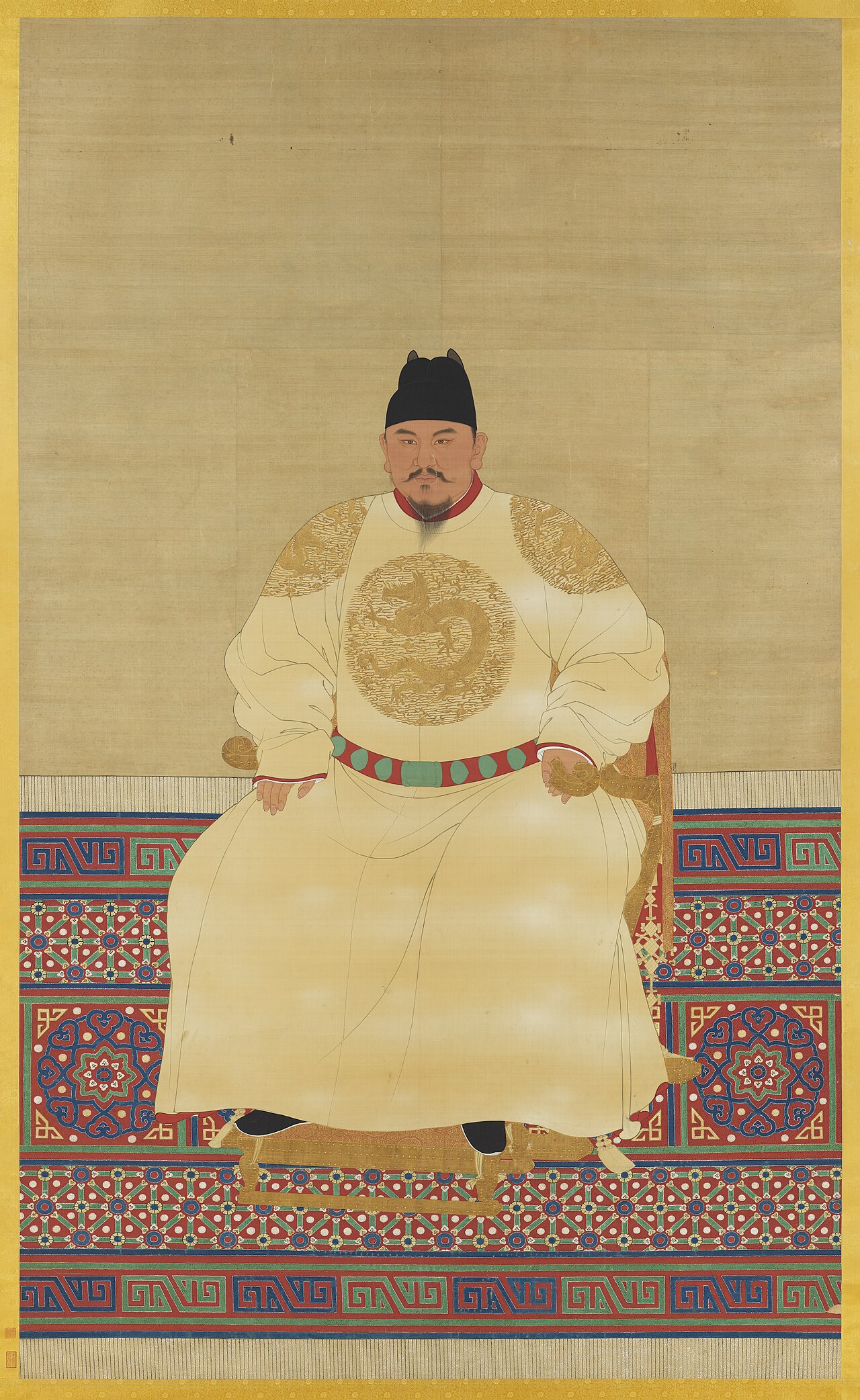 明代佚名画家所绘朱元璋坐像，身着黄色龙袍端坐